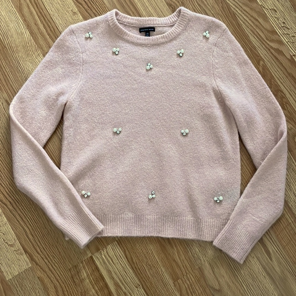 Baby pink sweater with pearl embellishments